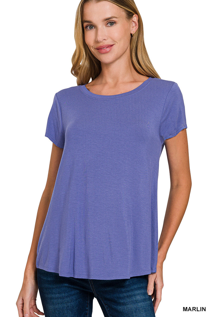 Effortlessly soft with a flattering drape, The Emerson is your go-to tee for everyday ease. Designed with a relaxed fit and a flowy round hem, it moves with you and pairs seamlessly with jeans, shorts, or layered looks.

Made from a lightweight rayon blend with a touch of stretch, this short sleeve essential offers breathable comfort and a flattering silhouette you'll reach for again and again.

Front Body Length: 25.5", Bust: 35" (measured from size Small)

95% Rayon, 5% Spandex

Color may vary slightly du